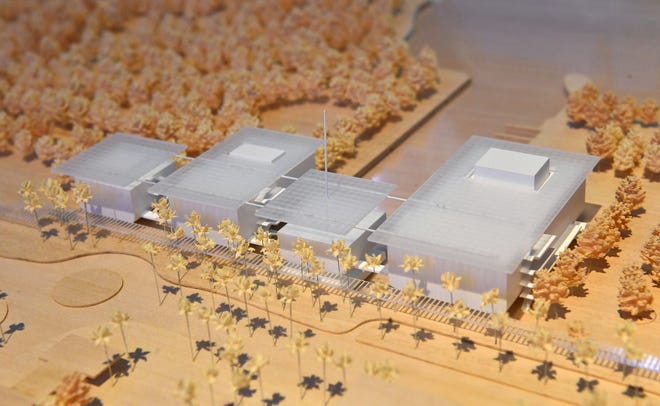 A large conceptual design model of the proposed Sarasota Center for the Arts on the city's waterfront. Columnist Carrie Seidman writes that she was shocked by the negative, disparaging social media response to her recent column raising questions about building an art gallery after 'of two great hurricanes.