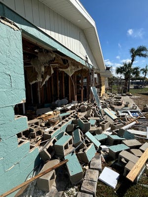 Author Carrie Seidman writes that the devastation caused by Hurricane Helene in September 2024, which destroyed this home in Lemon Bay, also had an emotional impact on local residents.