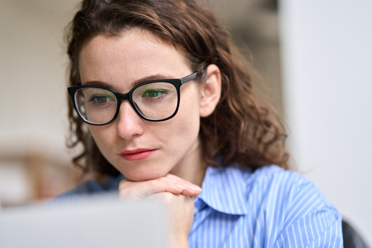 Young business woman wearing glasses at work